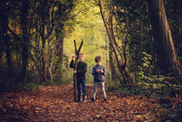 Brothers in the autumn woodland