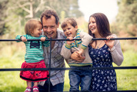 Family on fence at Ashton Court